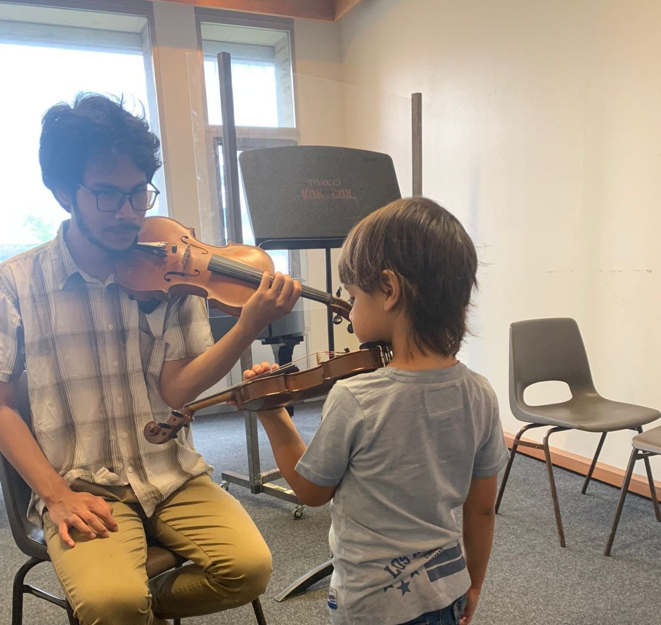 Yusuf violin teacher.jpg